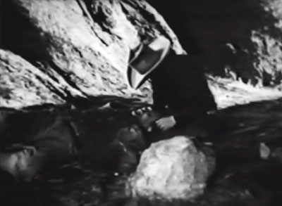 Rustlers of Red Dog--Rocky comforts dying henchman