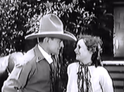 Roaring West--Buck Jones and Muriel Evans