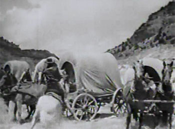 Blazing the Overland Trail--wagon attack stock